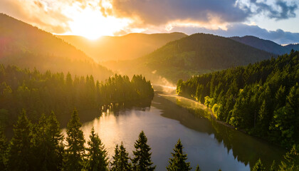 Golden Sunlight Shines Over Forest Mountains and Calm Lake Water at Dawn with Mist and Reflection Scenery in Peaceful Atmosphere and Serene Nature