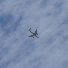 Plane in full flight on a clear blue sky over Sydney Australia