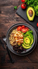 Healthy Grilled Chicken Quinoa Bowl with Avocado and Tomatoes.