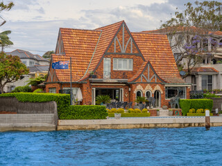 Residential Houses and apartment buildings on Parramatta River Sydney Harbour on a warm spring cloudy overcast day in Sydney NSW Australia 