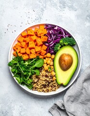 Colorful Healthy Buddha Bowl with Avocado Sweet Potatoes and Quinoa.