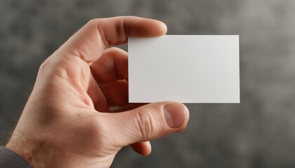 Business Card Being Held In Hand - This Image Shows A Hand Holding A Business Card, Presenting Information That Can Be Displayed For Promotion And Networking Purposes.