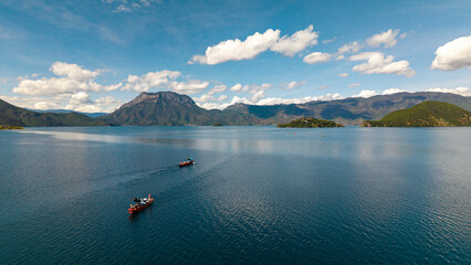 Pig trough boats on the lake, Lugu Lake in Yunnan, China