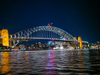 Harbour Bridge at Circular Quay on Sydney Harbour illuminated at night on a spring cool night in Sydney NSW Australia