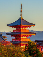 Pagoda of Kiyomizu-dera buddhist temple at autumn sunset, Kyoto, Japan