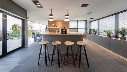 modern office break room with sleek countertops a coffee machine and stools