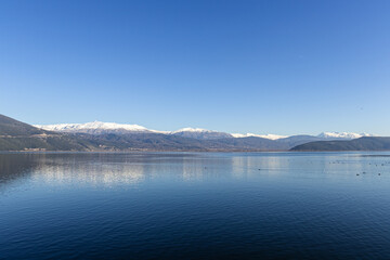 Mountains with snowy peaks and birds