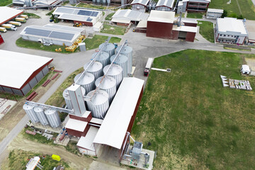 Modern poultry farm with solar panels. Factory using renewable energy. Aerial view