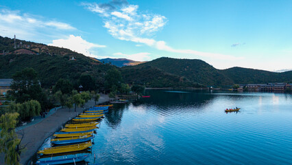 Pig trough boats on the lake, Lugu Lake in Yunnan, China