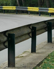 Curve of the Street — Black and Yellow Fence Divider.