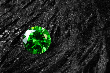 Close up of brilliant round green gemstone placed on dark textured rock, symbolizing luxury,...