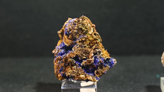 Crystals and minerals on display at the fair. Close-up of crystals. Turgite, mineraloid hematite.