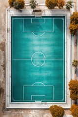 Bird's-eye view of a vibrant, verdant soccer field, showcasing the geometric precision of its design amidst a natural landscape.