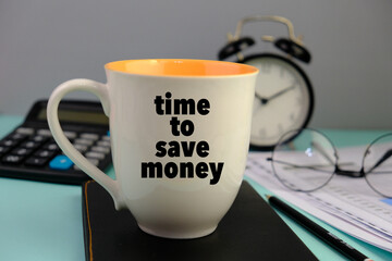 white mug with text TIME TO SAVE MONEY on the grey background 