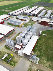 Modern poultry farm with solar panels. Factory using renewable energy. Aerial view