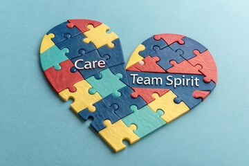 Jigsaw Puzzle Pieces Arranged Into Heart Shape Representing Team Spirit
