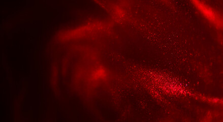 Red particles floating background, Liquid red metallic dust,  abstract backdrop. Beautiful metallic dust texture, fractal, paint close-up. Art Wallpaper waves surface. Real photo 