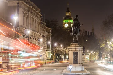 Fotobehang Londen rode bus Classic red double-decker bus on festive London street at night  © Alexey Fedorenko