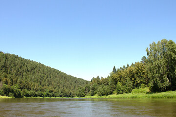 photo of the Ural River. hills and trees around