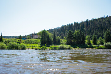 photo of the Ural River. hills and trees around