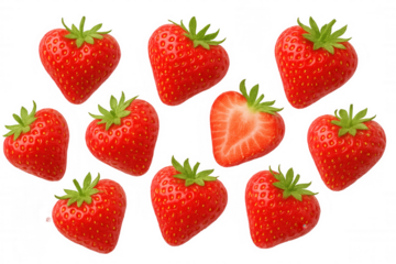 Fresh ripe strawberries shaped like hearts, including one cut in half, floating against a transparent background