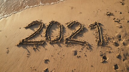 2021 year message handwritten in sand on beautiful beach background new years concept no logos no brands ar 169