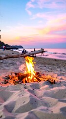 A bonfire glows on a sandy beach, with people silhouetted against a vibrant sunset
