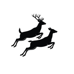 Two deer running in silhouette