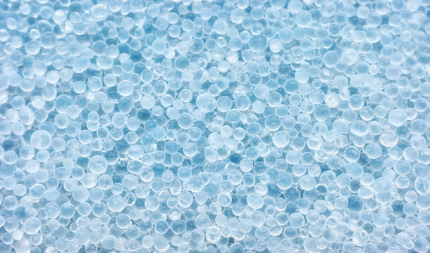 Closeup photo of silica gel beads, selective focus.