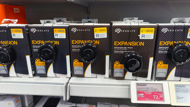 Potsdam, Germany - September 23, 2025: Seagate Expansion external hard drives displayed on retail shelf, showcasing various storage capacities and sleek packaging design for consumer electronics