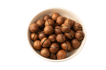 Macadamia nuts in a shell isolated on a white background.