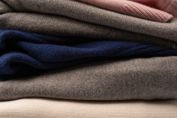 Fototapeta premium A group of warm sweaters isolated on a white background.
