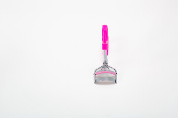 Pink and silver eyebrow brush on a clean background; precision bristles and metallic ferrule emphasize grooming and texture a professional beauty tool ideal for cosmetics.