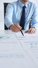 Business people analyzing financial charts and graphs during corporate meeting, focusing on data strategy, growth performance, and market planning