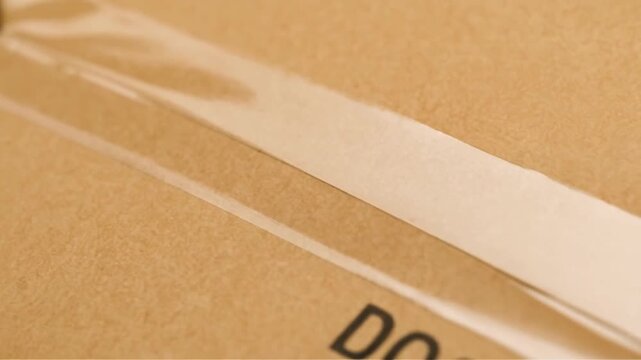 import rate concept. Close-up of a utility knife cutting a document mailer.