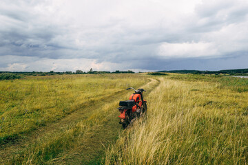 A Solo Cyclist Enjoying the Scenic Trail Surrounded by Beautiful Open Fields of Nature