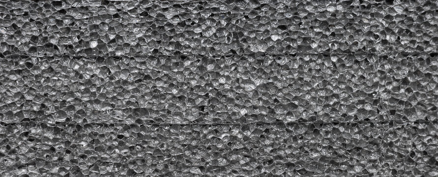 Closeup photo of closed cell polyethylene foam surface, abstract background.