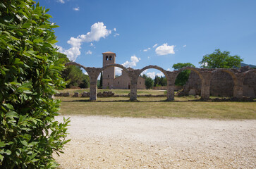 Abbey of San Vincenzo al Volturno, province of Isernia, Molise, Italy and in the foreground what remains of the Portico del Pellegrino