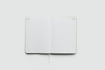 Open Notebook with Lined Pages on White Background