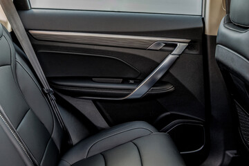 The design features a premium aesthetic with a brushed metallic trim strip, a sculptural...