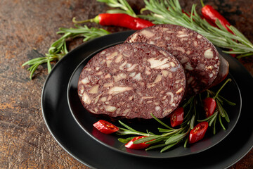 Blood sausage with pieces of meat.