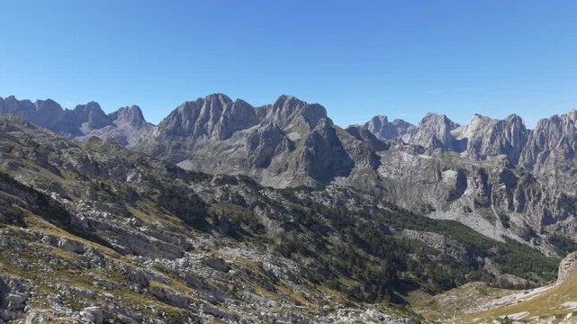 A hike day to the Albanian Mountains up to the border of Montenegro follow by a drone during Autumn or late summer season