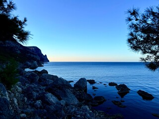 fantastic blue seascape, rocky sea coast, blue sea and blue sky