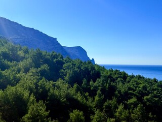 fantastic blue seascape, rocky sea coast, blue sea and blue sky