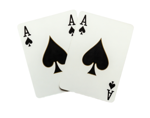 Two Ace of Spades playing cards overlapping, against a dark background
