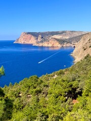 fantastic blue seascape, rocky sea coast, blue sea and blue sky
