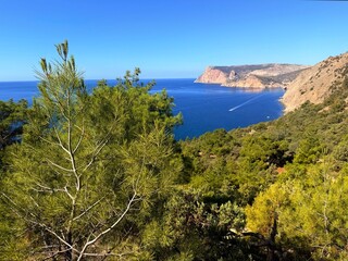 fantastic blue seascape, rocky sea coast, blue sea and blue sky