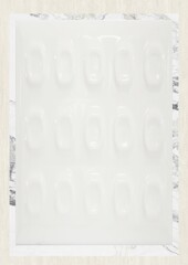 Blank sheet with faint embossed patterns and vertical text on the edges