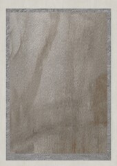 Close-up of a textured beige fabric with subtle folds and discoloration