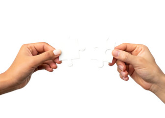 Two hands holding jigsaw puzzle pieces representing connection and collaboration against a black background emphasizing unity and teamwork